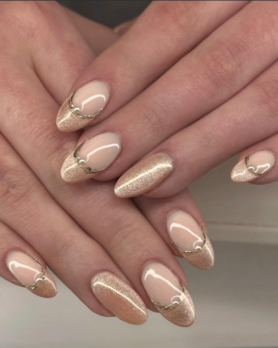 Neutral almond gel manicure with fine gold line detail from Oh Baby Salon & Spa in Bloomington, Illinois