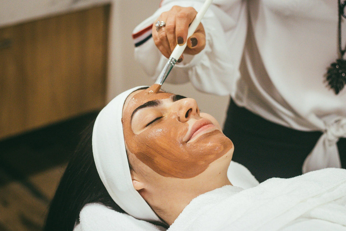 A guest receiving a facial mask treatment at Oh Baby Salon and Spa in Bloomington, Illinois